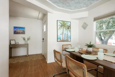 a dining room with a table and chairs at Cozy Chic Casa ,Spa ,Ac ,Theatre , Downtown, Beach in La Mesa