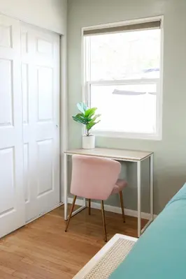 a bedroom with a desk and a chair and a window at Cozy Chic Casa ,Spa ,Ac ,Theatre , Downtown, Beach in La Mesa