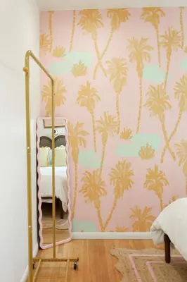 a bedroom with palm trees on a pink wall at Cozy Chic Casa ,Spa ,Ac ,Theatre , Downtown, Beach in La Mesa