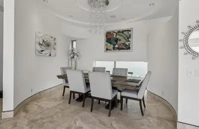 a dining room with a wooden table and chairs at The Wave House! Custom Gem with Panoramic Views, Fire Pit, BBQ, Pool Table in San Diego