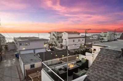a view of a city with buildings and the ocean at Ocean Views Steps to Beach Rooftop Firepit in San Diego