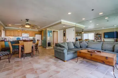 a living room with a couch and a table at Bayside Gem - Beachfront - Vibrant - Ocean Breeze in San Diego