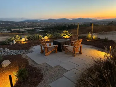 a patio with two chairs and a table with a view at The Hilltop Haven - Private View Suite in Temecula
