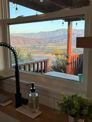 a window in a room with a view of the desert at The Hilltop Haven - Private View Suite in Temecula