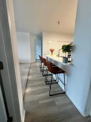 a kitchen and dining room with a table and chairs at Cozy Luxurious Spacious Apt with Valley View, Attached Garage,Pool,24-Hour Gym, 3 TV in Mission Viejo