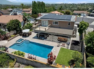 an aerial view of a house with a swimming pool at OC Heated Pool,Fire Pit,Spa,BBQ,Disney,Beaches in Mission Viejo