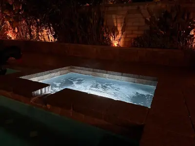 a hot tub in a fire pit at night at OC Heated Pool,Fire Pit,Spa,BBQ,Disney,Beaches in Mission Viejo