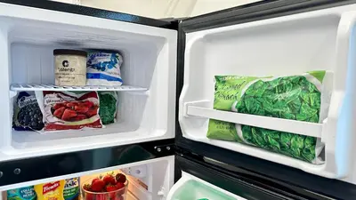 an open refrigerator filled with food and vegetables at Bay View Bungalow in San Diego