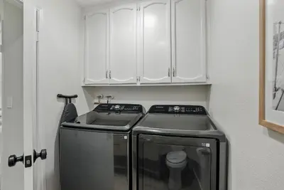 a small kitchen with a stove and a sink at Solana Beach Gem - AC and Beach Access in Solana Beach