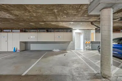 an empty parking garage with a car parked in it at Solana Beach Gem - AC and Beach Access in Solana Beach