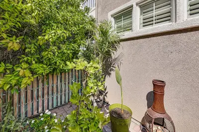two vases sitting on a table next to a fence at Extended-Stay Suite Near I-15 in Lake Elsinore! in Lake Elsinore