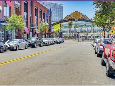 a street with cars parked on the side of the road at Gaslamp District Heart of San Diego in San Diego