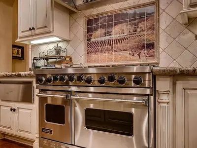 a kitchen with a stainless steel oven in a kitchen at La Bella Vista Estate in Fallbrook