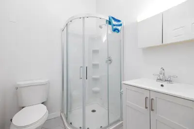 a bathroom with a shower and a toilet and a sink at Ocean Views 2 Kitchen Living area Villa in San Diego