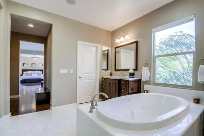 a large bathroom with a tub and a sink at Daydream Palace in Chula Vista