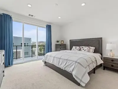 a bedroom with a bed and a large window at Beautiful Irvine Grand Park Community Cozy and Comfortable Home in Irvine