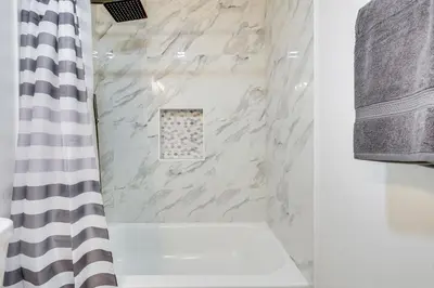 a bathroom with a shower curtain and a sink at Day Trip to San Diego San Marcos Home Near Hiking in San Marcos