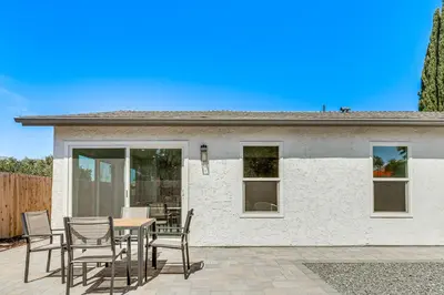 a patio with a table and chairs in front of a house at Day Trip to San Diego San Marcos Home Near Hiking in San Marcos
