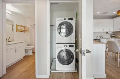 a kitchen with a washer and dryer in a room at LUX Oasis North Park, King Beds, Workspaces, Parking in San Diego