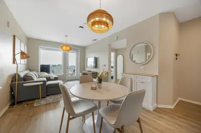 a living room with a table and a couch at LUX Oasis North Park, King Beds, Workspaces, Parking in San Diego