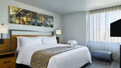 a hotel room with a bed and a tv at Marriott Vacation Club San Diego Studio Apartment with Resort Access in San Diego