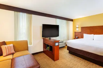 a hotel room with a bed and a flat screen tv at Hyatt Place San Diego-Vista/Carlsbad in Vista