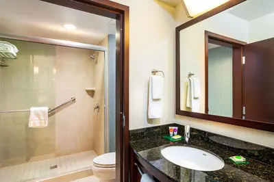 a bathroom with a sink and a toilet and a shower at Hyatt Place San Diego-Vista/Carlsbad in Vista