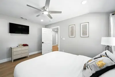 a bedroom with a white bed and a ceiling fan at Xlnc Exotic Home Witt Rd Poway in Poway