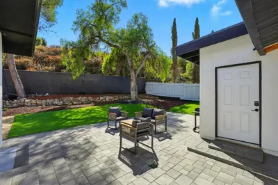 a patio with chairs and a table in a yard at Xlnc Exotic Home Witt Rd Poway in Poway