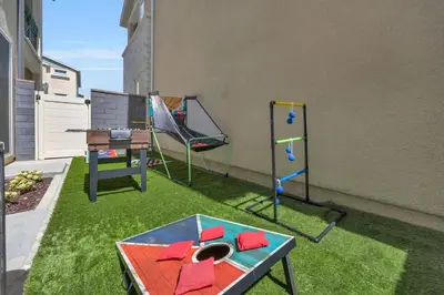 a backyard with a playground with a table and swings at Luxury Resort Pool Spa Arcade Movie Gym in Mission Viejo