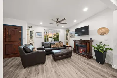 a living room with a couch and a fireplace at 2br Pet-Friendly Oceanside Home in Oceanside