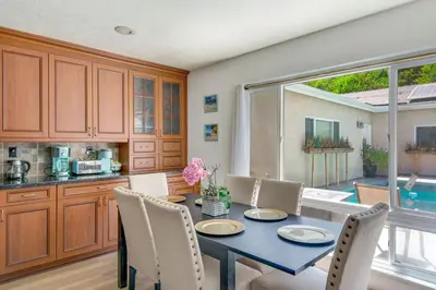a kitchen and dining room with a table and chairs at Relax Explore from Mission Viejo Pool Spa in Mission Viejo