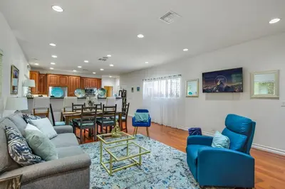 a living room with a couch and a dining room at Relax Explore from Mission Viejo Pool Spa in Mission Viejo