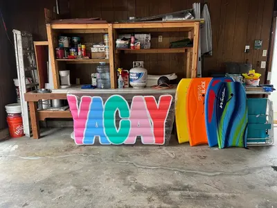 a group of surfboards are lined up in a garage at Beach Home in Quiet Neighborhood 5 minutes from the Pier in Oceanside