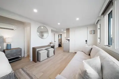 a living room with a couch and a table at New Modern Studio - Stunning Ocean view in San Diego
