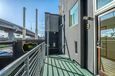 a balcony of a building with a view of a bridge at Hotel Narcissus - Room 1 in San Diego