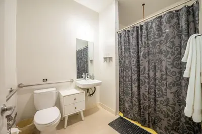 a bathroom with a toilet and a sink at Hotel Narcissus - Room 1 in San Diego