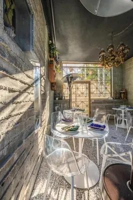 a restaurant with tables and chairs in a room at Hotel Narcissus - Room 3 in San Diego