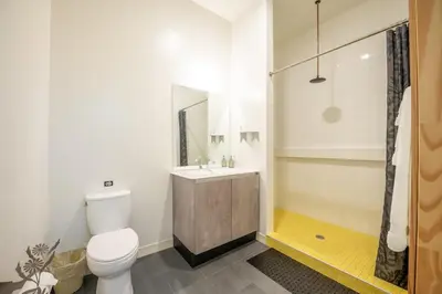 a bathroom with a toilet and a sink and a shower at Hotel Narcissus - Room 3 in San Diego