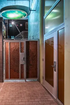 an entrance to a building with a revolving door at Hotel Narcissus - Room 5 in San Diego