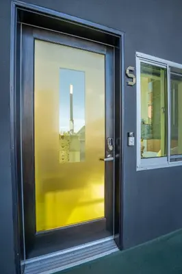 a door to a building with a view of a window at Hotel Narcissus - Room 5 in San Diego