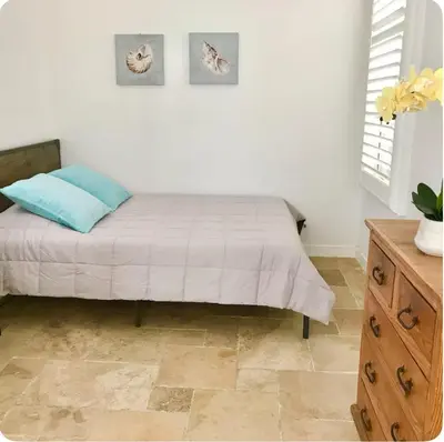 a bedroom with a bed and a wooden dresser at Corporate Housing, Vacation Rental in Irvine in Irvine