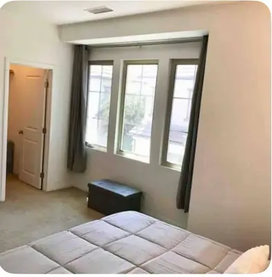 a bedroom with a bed and two windows at Corporate Housing, Vacation Rental in Irvine in Irvine