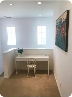 a desk with a chair in a room with windows at Corporate Housing, Vacation Rental in Irvine in Irvine