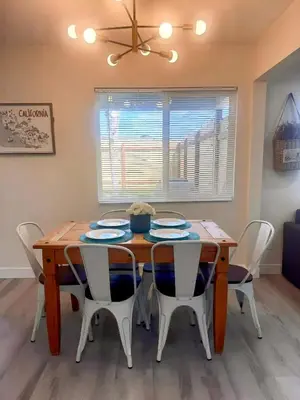 a dining room with a wooden table and chairs at Sea & Sun Getaway near Seaworld in San Diego