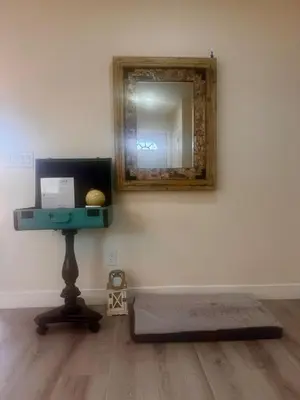 a mirror on a wall with a mattress and a table at Sea & Sun Getaway near Seaworld in San Diego