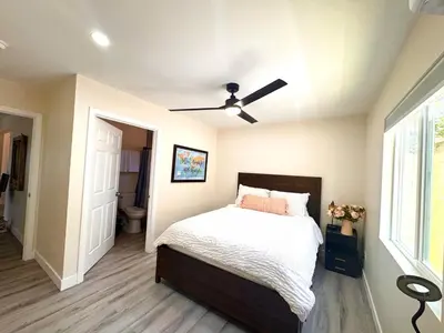 a bedroom with a bed and a ceiling fan at Sea & Sun Getaway near Seaworld in San Diego