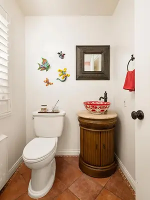 a bathroom with a white toilet and a sink at La Jolla Gem Ocean Views Walk to Village Beach in San Diego