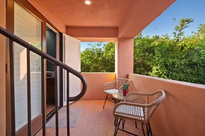 a porch with two chairs and a table on a balcony at La Jolla Gem Ocean Views Walk to Village Beach in San Diego
