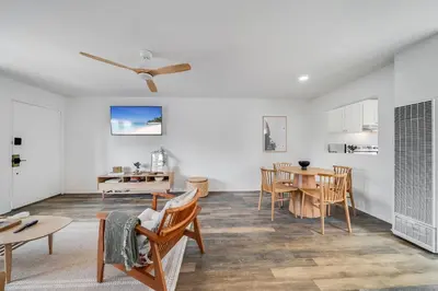 a living room with a table and chairs at Jewell Street Gems Two homes in one in San Diego